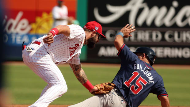 Feb 28, 2024; Clearwater, Florida, USA; Philadelphia Phillies third baseman Weston Wilson (37) tags out Atlanta Braves second baseman Luis Guillorme (15) during the third inning at BayCare Ballpark. Mandatory Credit: Kim Klement Neitzel-USA TODAY Sports  